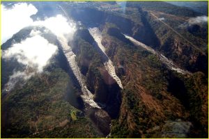 Flying over Zambezi River gorge. Victoria Falls on the left, Zimbabwe underneath, Zambia far bank