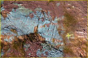 Colorful stream bed in Maragua Crater