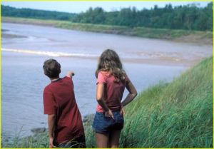 Maria and Tom watching tidal wave on The River Hebert