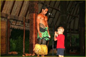 Drinking coconut juice, Polynesian Cultural Center, Oahu