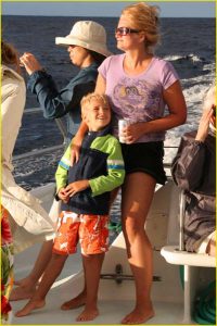 On the deck of catamaran off Napali Coast, Kauai