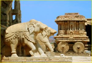 Garuda Shrine (on the right) fashioned as chariot at Vitthala Temple in Hampi, Karnataka