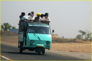 Traveling party on a 3-wheel autorickshaw