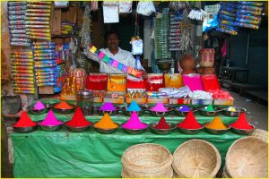Selling coloured powders at Devaraja Market in Mysore, Karnataka
