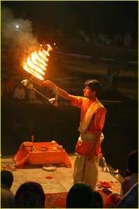 Ganges riverbank ganga aarti ceremony with puja (worship or hindu mass), fire show and dancing at Dasaswamedh Ghat in Varanasi, Uttar Pradesh