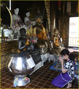 Praying in Wat Inthakhin Saduemuang, Chiang Mai, Thailand
