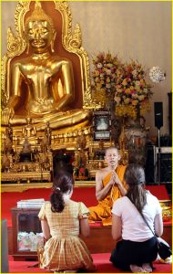 In front of Golden Buddha in Wat Traimit, Bangkok