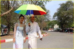 Young couple in front of Mandalay Palace, Myanmar