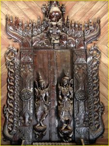 Ornate carvings in teak monastery of Shwe In Bin Kyaung in Mandalay, Myanmar