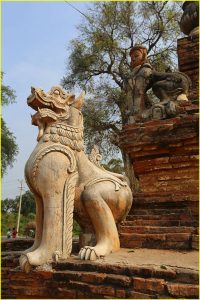 Stone lion at a ruined temple in Inwa, near Mandalay, Myanmar