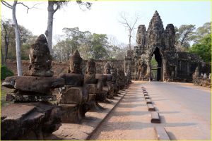 Approach to South Gate to Angkor Thom lined (on the left side) with statues of gods, Cambodia