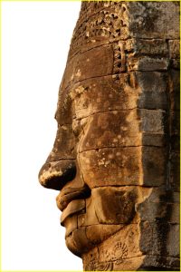 Mysteriously smiling stone face at the Bayon, Angkor, Cambodia
