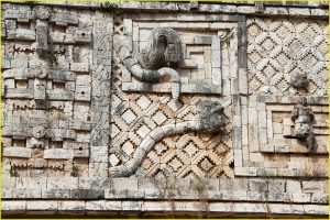 Feathered serpent (Kukulcan) and long-nosed face of Chac motifs on the Western facade of the Nuns' Quadrangle, Uxmal