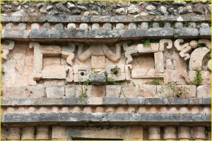"Descending gods" on facade of El Palacio, Sayil